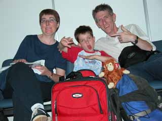 Charlotte Ryan, Peter Ryan, Zig-Zag and Jerome Ryan wait at the airport for our flight to Paris